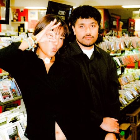 Fisheye FM 2 people - Fisheye FM - posing for a picture in a record store